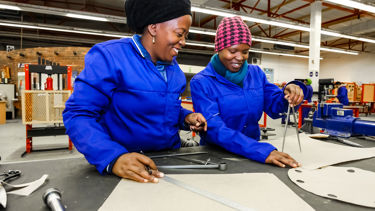 Women working together, focusing on skills