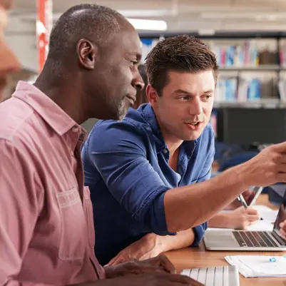 Men learning on a pc Men learning on a pc